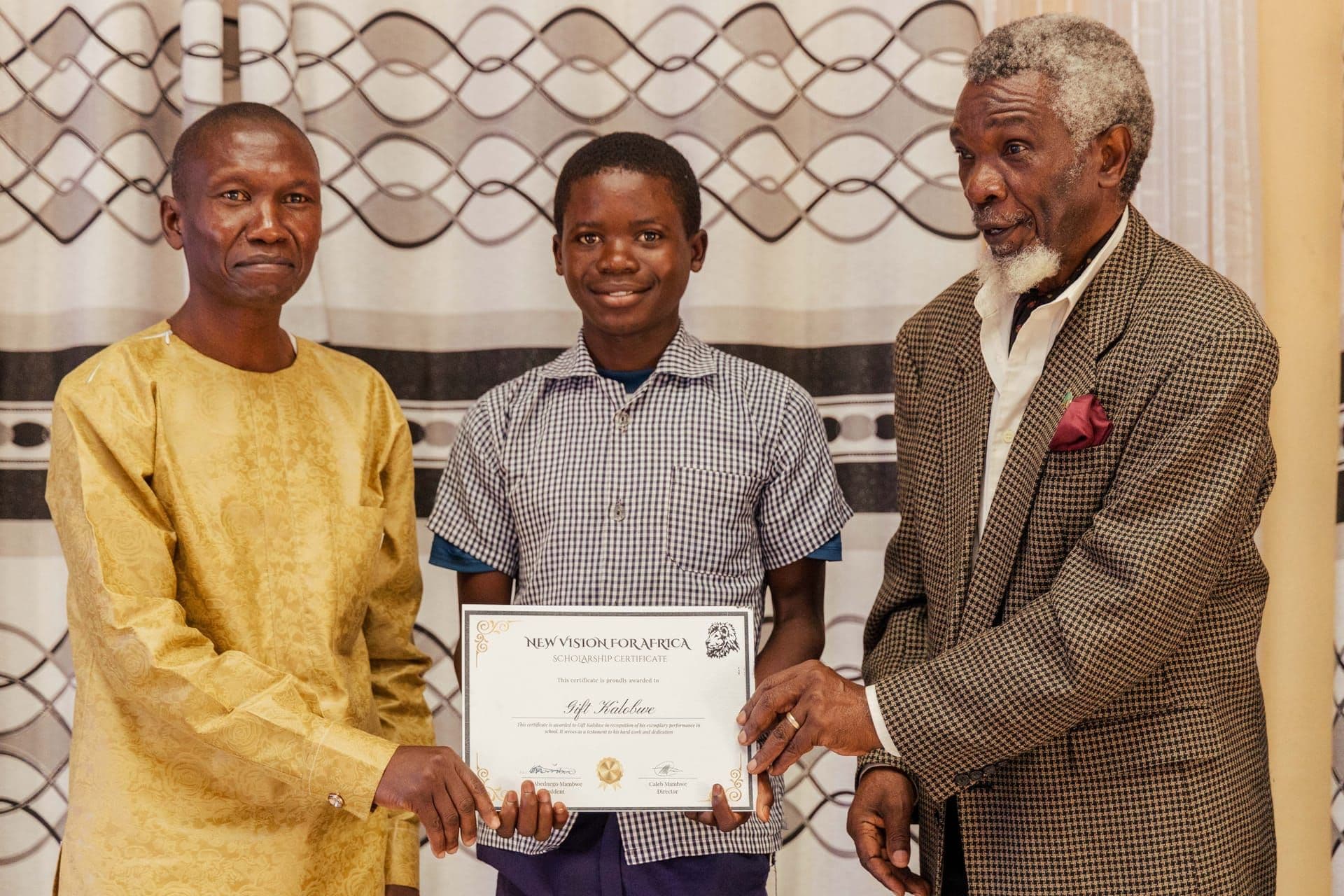 Students receiving certificates at a graduation ceremony